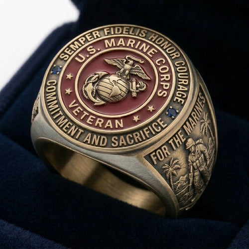 Bronze U.S. Marine Corps veteran ring with engraved text on a dark background
